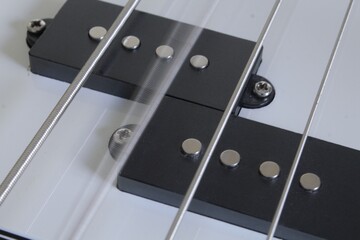 close up of an electric bass and a wving string