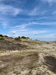 Fototapeta na wymiar Beautiful dunes with seascape background, perfect surface of the sea