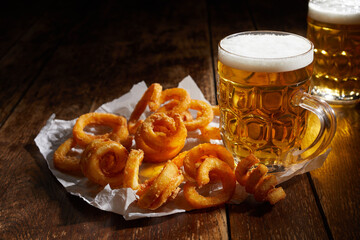 Tasty potato curls and mugs of beer