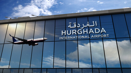 Airplane landing at Hurghada Egypt airport mirrored in terminal