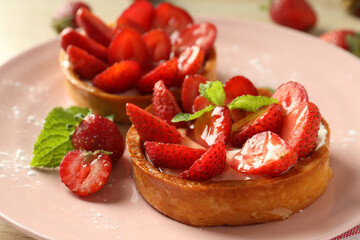 Concept of delicious food with strawberry tarts, close up