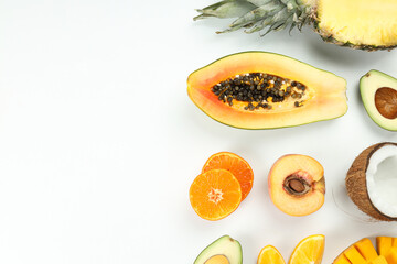 Fototapeta na wymiar Exotic fruits on white background, space for text