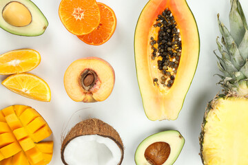 Flat lay with exotic fruits on white background