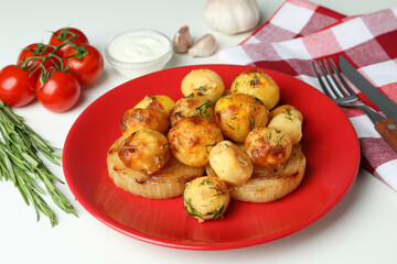 Concept of tasty food with baked potato on white background