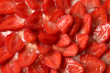 Delicious strawberry tart all over background, close up