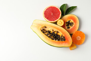 Exotic fruits on white background, space for text