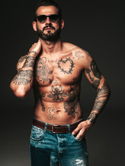 Portrait of handsome confident stylish hipster lambersexual model. Sexy modern man. Naked torso...
