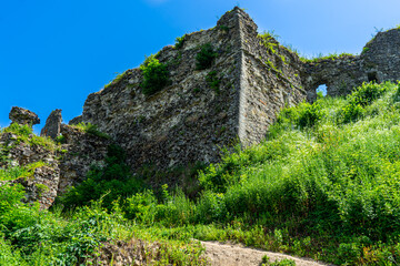 Fototapeta na wymiar Ruins of Khust castle which was built as a fortress to protect the salt road from Solotvyno in Khust, Ukraine on June 24, 2021.