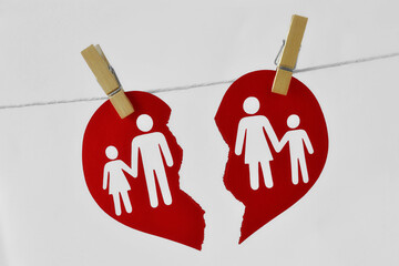 Broken heart with familiy hanging on clothesline - Divorce and broken family concept