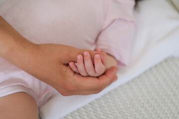  little babys hand hold mothers finger. Happy family