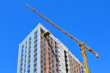 Crane and highrise construction site