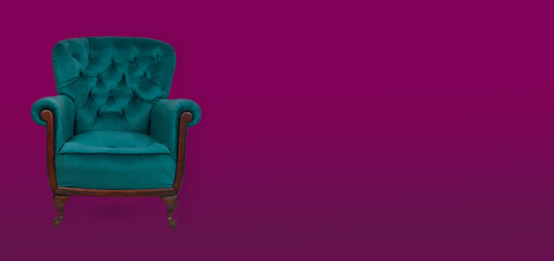 Elegance teal armchair on a maroon background. Copy space for text - banner.