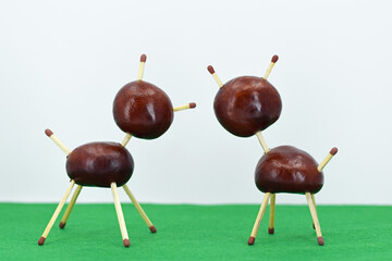 Two animal figurines made of chestnuts. Creative fun in autumn time, hobby for children