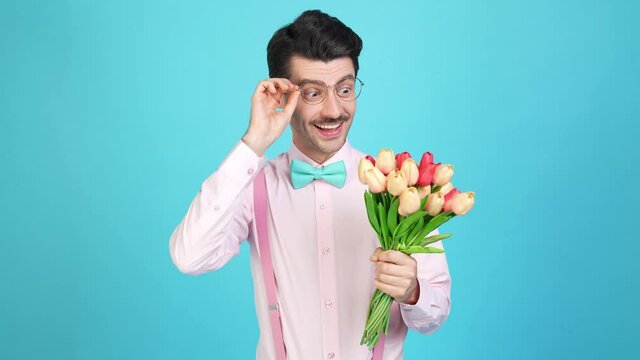Cheerful tempting nerd guy prepare date nervous mood exciting flowers relief