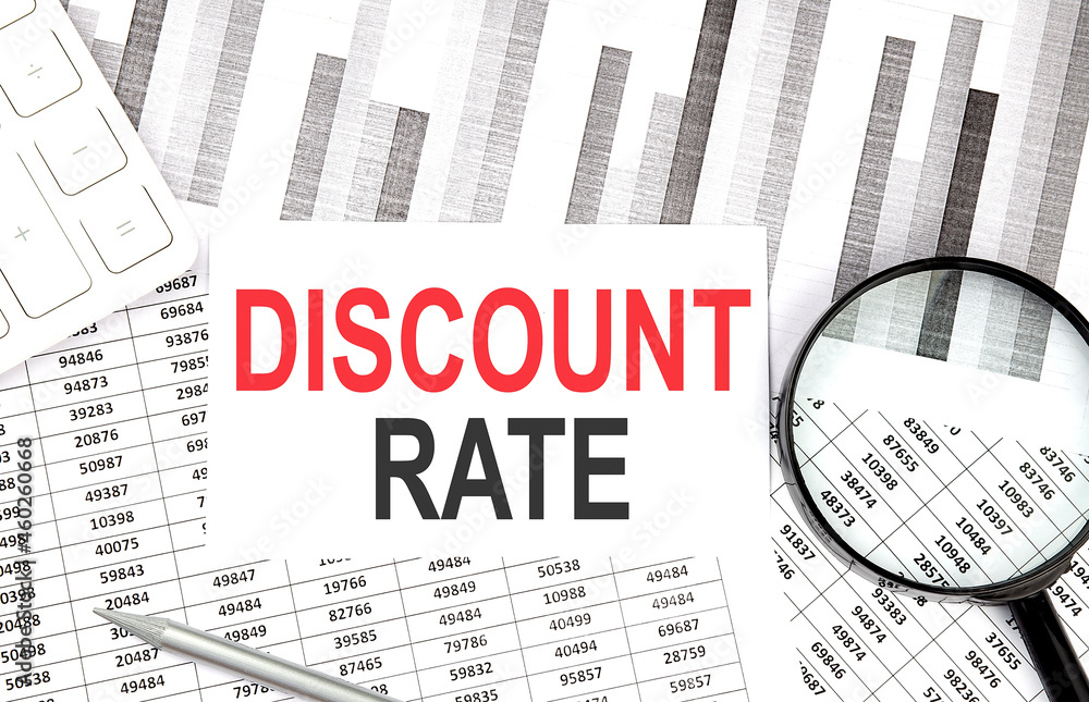 Poster discount rate text on paper with calculator,magnifier ,pen on graph background