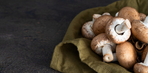 Portobello , widely consumed mushroom varieties in the world, on the linen napkin.Large image for banner.Copy space