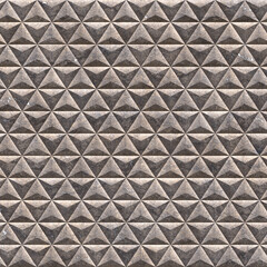 Basalt Flemish triangular tiles. Tiles with basalt granulate in the form of triangles cover the entire surface of the background. Construction abstract gray background with tiles. 3D-rendering