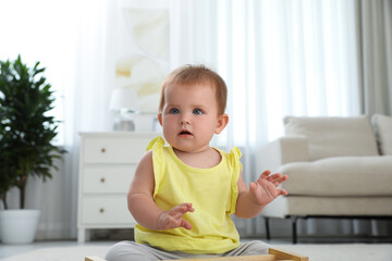 Fototapeta premium Cute little redhead baby in living room