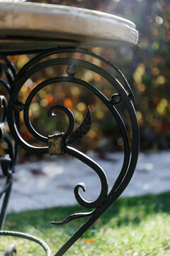 forged table leg in the sunlight close-up.
