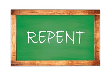 REPENT text written on green school board.