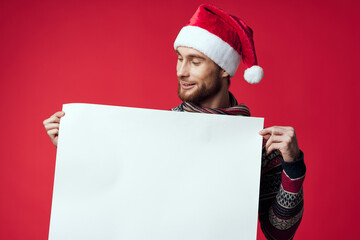 Cheerful man in New Year's clothes advertising copy space isolated background