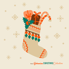 Boho Christmas stocking filled with gifts and candy cones. Bohemian Christmas socks isolated. Great symbol for Christmas cards, posters, stickers, wall art. Hand drawn in flat cartoon simple style
