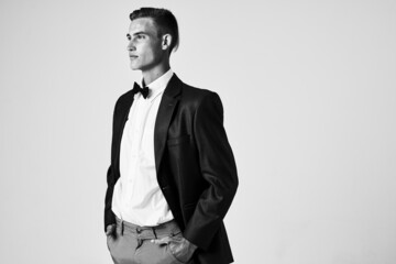 consumable hairstyles in a black jacket bow tie model studio