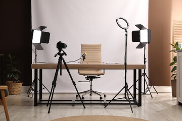Fototapeta na wymiar Modern blogger's workplace with professional equipment in room