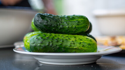 hand-made pickled cucumbers in a jar. Ręcznie robione ogórki kiszone w słoiku.