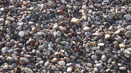 Small pebbles on a stone beach 