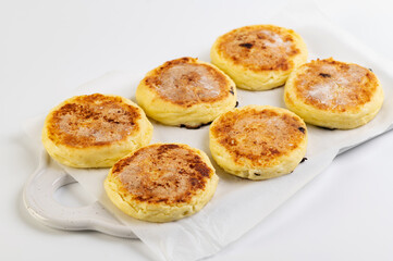 round cheesecakes, curds, on a white background
