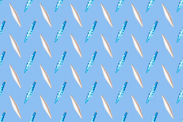 Seamless Christmas pattern from blue and white cones toys on blue background