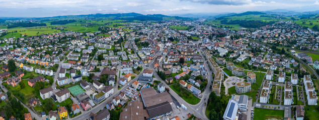 Aerial view of the city gossau in Switzerland on a overcast day in summer.	