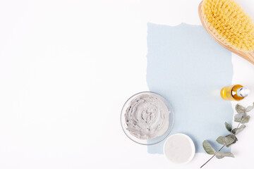 Layout of blank organic paper card next to natural clay cosmetics