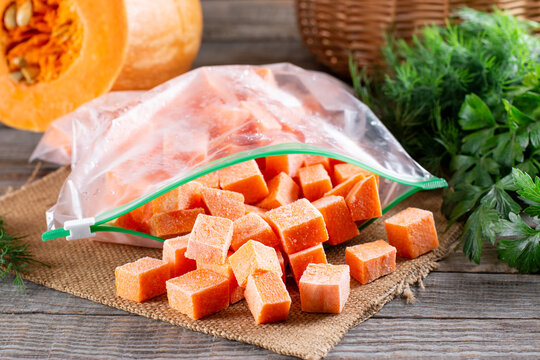 Frozen diced pumpkin. Food background of freshly frozen diced pumpkin. Food products for long-term storage.