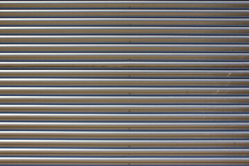 Metal curtain and a facade of a shop