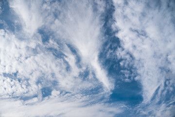 Bizarre white clouds in blue sky