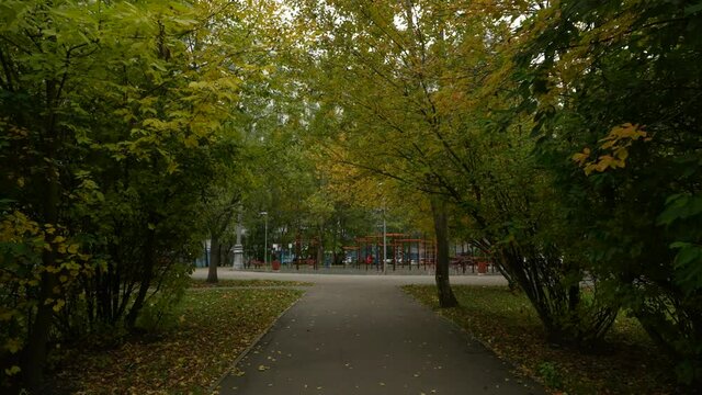 Outdoor sports ground in the courtyard of a residential building. Autumn landscape. dolly camera shot