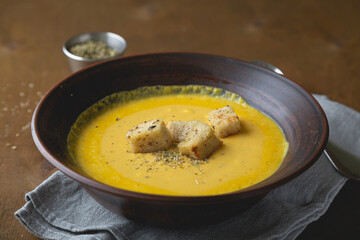 Hot autumn cream soup with vegetables and cheese