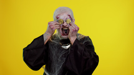 Spooky man with bloody scars face, Halloween zombie showing golden bitcoins. Achievement career...