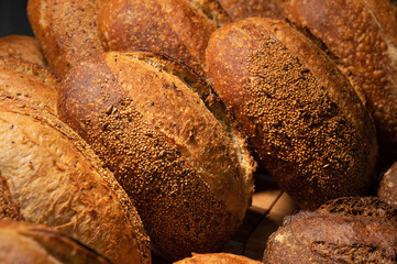 Freshly baked hot loaves of crispy artisan bread close-up. Healthy foods and proper nutrition
