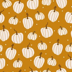 Seamless autumn pattern. cute white pumpkins and dots on a mustard background. vector texture. trend print for textiles, wallpaper and packaging.