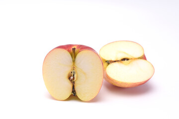 Ripe red apple isolated on white background. Cut in half