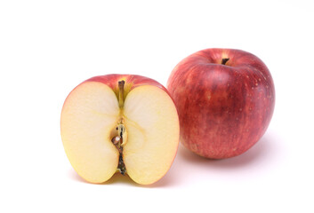 Ripe red apple isolated on white background. Cut in half