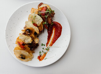 meat and potato chips salad. On a white background