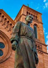 Lovely low angle close-up of the memorial statue of Charles de Foucauld in front of the Saint-Pierre-le-Jeune Catholic Church in Strasbourg. He was assassinated in 1916.