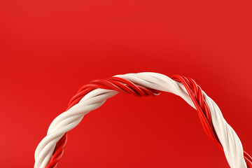 Electric wires on red background, closeup view