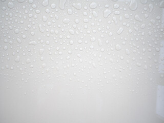 water droplets on white tiled floor