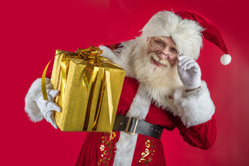 Emotional senior male model old man with a natural white beard in the role of Father Christmas