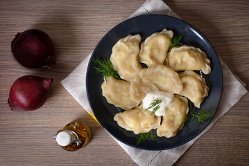 Dumplings with meat cherries vegetables cabbage pork turkey beef. A traditional Russian dish. Delicious and healthy breakfast.